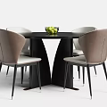 Black Round Dining Table With Four Chairs Brown Backrests Light Seats And Green Fruit Bowl