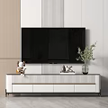 White TV Cabinet With TV Green Plant Decorations And Vertical Striped Wall
