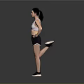 Active Woman in White Sports Bra and Black Shorts Posing with Hands on Hips