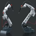 White Industrial Robotic Arms With Red Cables And Gray Bases For Industrial Equipment Use