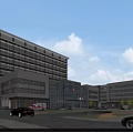 Modern Multi Story Hospital Building Exterior With Glass Windows And Landscaping