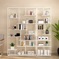Modern Open White Shelving Unit With Books Decorative Items And Green Plants For Home Organization