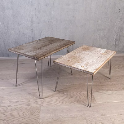 Two Wooden Top Metal Leg Stools Against Grey Wall On Wooden Floor 3d model