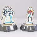 Two Character Figurines With Shiny Silver Bases Featuring Mecha And Humanoid Designs 3d model