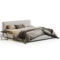 Cozy Bedroom Interior With Neutral Tones Bed Pillows Blanket And Black Side Table
