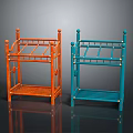 Orange And Blue Metal Shelving Units With Multiple Shelves And Decorative Top Finials