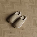 Comfortable Beige Linen Slippers With White Soles On Herringbone Wooden Floor