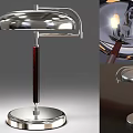 Modern Table Lamp With Chrome Lampshade Wooden Pole Round Base And Illuminated Bulb