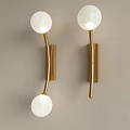 Modern Wall Lamps With Gold Brackets And Double White Globe Shades Mounted On Beige Wall