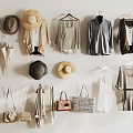 Fashionable Clothes Hanging On Wall With Various Hats Bags And Umbrellas