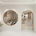 Yue Jiaoniang Reception Counter Area With White Cabinets Curved Column Circular Light And Green Plant