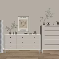 Elegant Modern Console and Side Cabinet with White Drawers Decorative Vase Ornaments and Wall Art