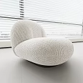 Textured White Corduroy Single Sofa With Curved Shape In Modern Bright Interior With Window Blinds