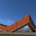 Modern Geometric Building With Rustic Metal Facade Glass Windows Green Lawn And Blue Sky