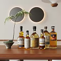 Whiskey Bottles and Wine Glasses on Wooden Table with Decorative Circular Lights and Palm Plant