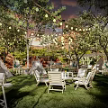Cozy Camping Camp with Green Grass Tents String Lights and Wooden Tables