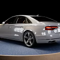 Silver Audi Luxury Sedan Displayed On Blue Platform With Black Background 3d model