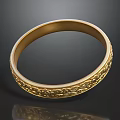 Gold Bracelet With Intricate Carved Patterns On Black Background With Reflection