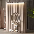 Elegant Wooden Slat Room Divider With Circular Hollow Design Decorative Balls And Green Plant