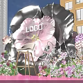 Giant Flower Shaped Photo Check In Spot With Pink Black Petals And White Chair
