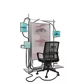 Interactive Art Installation With Black Chair Metal Frame And Screens Showing Eye And Face