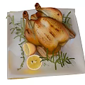 Delicious Roast Chicken With Fresh Rosemary And Lemon Slices On White Plate