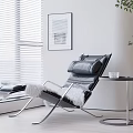 Modern Black Lounge Chair with Metal Frame Footrest and Side Table by Window with Blinds