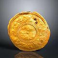 Golden Circular Carved Artifact With Intricate Floral Patterns And Decorative Design