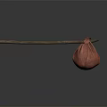 Long Wooden Stick With Hanging Red Fabric Bag On Dark Reflective Surface
