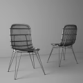 Modern Rattan Leisure Chairs With Black Metal Legs Against White Brick Wall