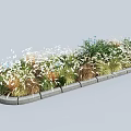 Diverse Shrubs In Long Garden Flower Bed With Ornamental Grasses And Concrete Stone Border
