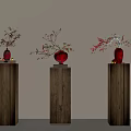 Three Elegant Wooden Pedestals Featuring Red Vases And Flower Branches