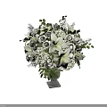 White Floral Arrangement With Lilies Roses Hydrangeas In Glass Vase And Green Leaves