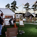 Scenic Campsite With Tent RV String Lights Trees And Picnic Tables