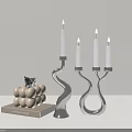 Elegant Modern Silver Curved Candle Holder With White Candles And Decorative Ornaments