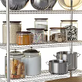 Stainless Steel Storage Shelves with Black Baskets Pots Jars Food Items and Wicker Basket