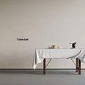 Tablecloth Covered Wooden Table With Bowl Fruits And Black Vase In Minimalist Interior