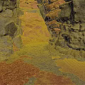 Natural Rocky Crevice With Rough Rock Walls And Scattered Red Sand Pathway