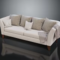 Neutral Colored Ivory Two-Seater Sofa with Soft Cushions and Gray Throw Blanket on Wooden Legs