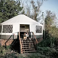 White Dome Canopy Tent with Diamond Pattern Windows and Wooden Stairs in Natural Outdoor Area