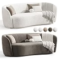 Two Seater Sofa In Neutral Tones With Round Square Pillows And Knitted Throw Blanket