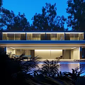 Modern Detached Villa With Modern Design Illuminated Exterior Large Windows And Swimming Pool Surrounded By Trees