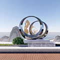 Outdoor Metal Sculpture With Interlaced Circular Rings Coastal Waterfront Rocks And Green Plants
