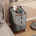 Gray Bedside Table with Drawers Black Handles Wireless Charger Phone Cup and Robot Vacuum Nearby