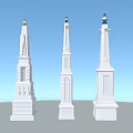 Three White Decorative Towers With Ornate Tops Against Light Blue Sky