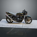 Black and Yellow Striped Motorcycle Parked on Gray Mat with Dark Background