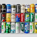 Assorted Colorful Beverage Cans Collection With Various Brands And Flavors Stacked Together