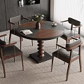 Modern Dining Space With Round Wooden Table Leather Chairs Vase Books And Potted Plant