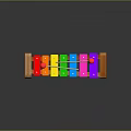 Colorful Wooden Xylophone with Multicolored Keys and Red Mallets on Dark Glossy Surface