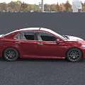 Red Toyota Sedan Modern Exterior Design With LED Headlights And Alloy Wheels